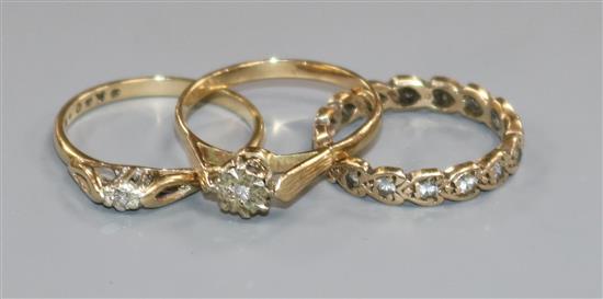 Three 9ct gold and diamond set rings.